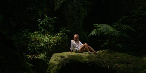 young-woman-jungle-lets-out-puffs-smoke-vape